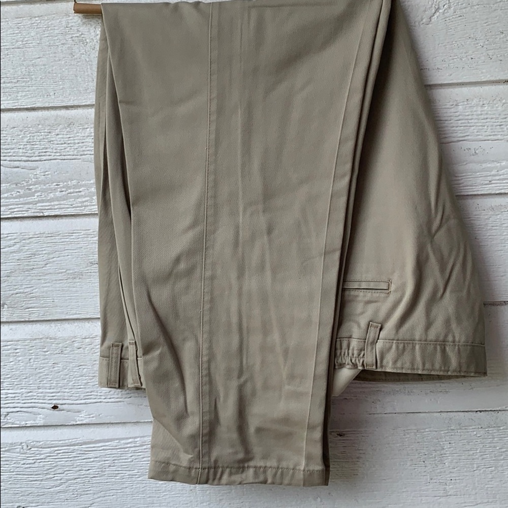 Men’s tan slacks  size 46 x 30.   Dry cleaned.